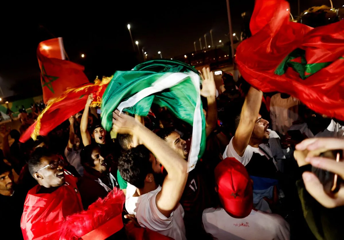 Morocco fans celebrate outside the stadium after the penalty shootout as Morocco progress to the quarter-finals during  FIFA World Cup Qatar 2022, Round of 16 matches between Morocco and Spain, at Education City Stadium, Al Rayyan, Qatar, on Dec. 6, 2022.
(Hamad I Mohammed/Reuters)