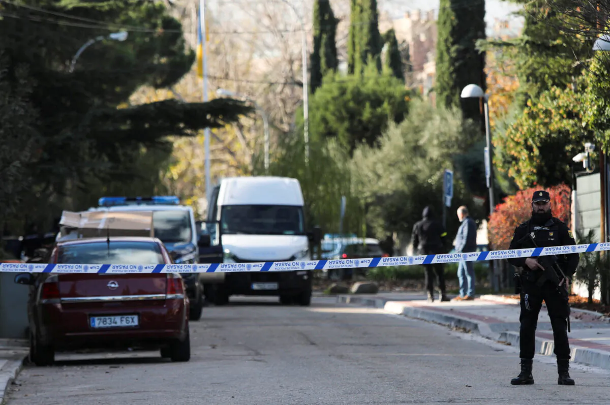 Police cordon off the perimeter outside the Ukrainian embassy in Madrid after a bloody package arrived at the embassy, on Dec. 2, 2022. (Violeta Santos Moura/Reuters)