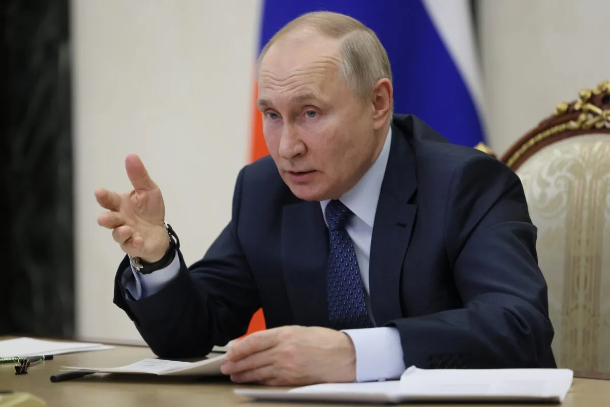 Russian President Vladimir Putin gestures while speaking during the annual meeting of the Presidential Council for Civil Society and Human Rights via videoconference in Moscow on Dec. 7, 2022. (Mikhail Metzel, Sputnik, Kremlin Pool Photo via AP)