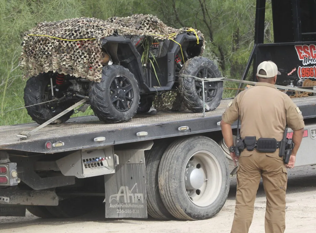 An ATV vehicle is removed from the scene where a border patrol agent was killed in Mission, Texas, on Dec. 7, 2022. (Delcia Lopez/The Monitor via AP)