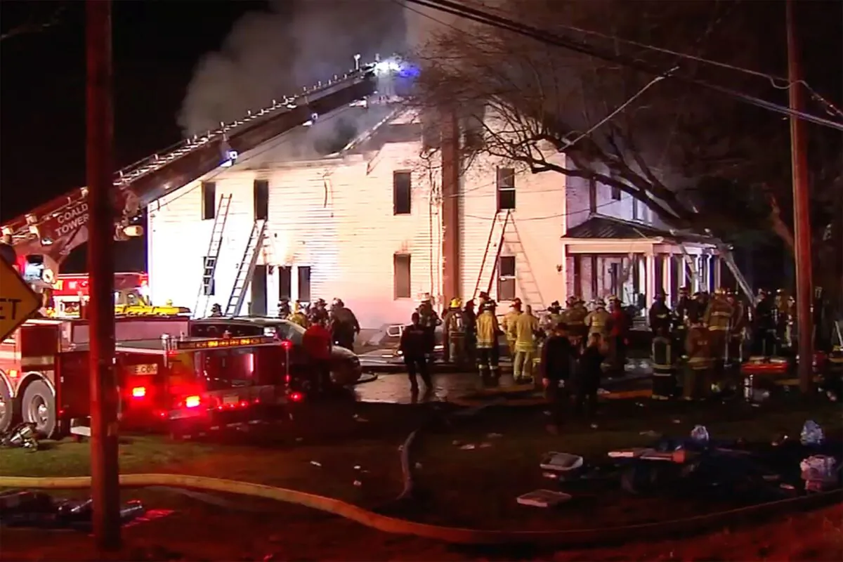 Firefighters work on the scene of a house fire in West Penn Township, west of Allentown, Pa., on Dec. 7, 2022. (WFMZ-TV via AP)