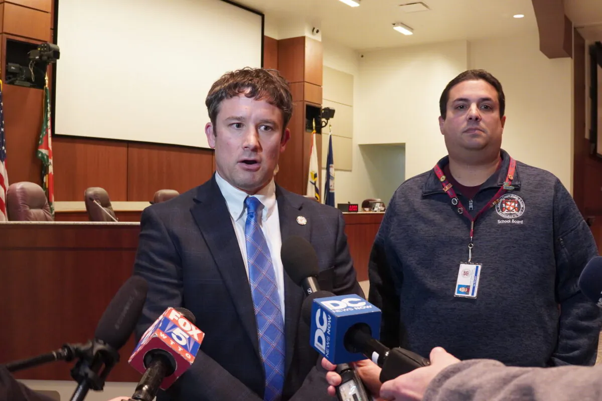 Loudoun County Public Schools interim superintendent Daniel Smith (L) and school board vice chair Ian Serotkin speak to the media on the night of Smith's appointment in Ashburn, Va., on Dec. 8, 2022. (Terri Wu/The Epoch Times)