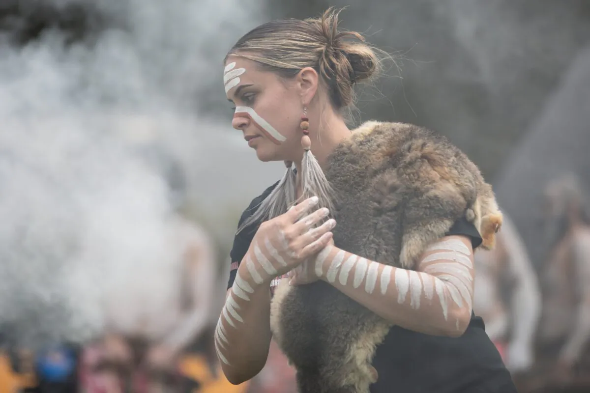 Indigenous dancers perform during a Smoking Ceremony during the state funeral service for Uncle Jack Charles at Hamer Hall in Melbourne, Australia, on Oct. 18, 2022. (AAP Image/Diego Fedele)