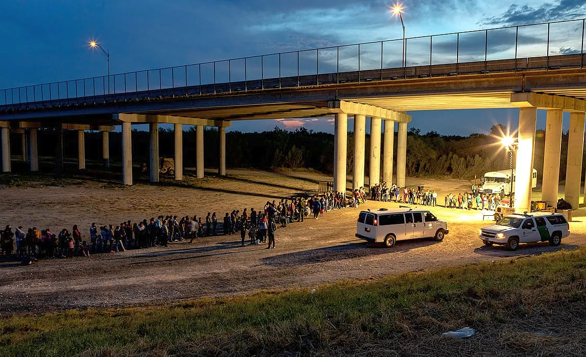 At sunset near McAllen, Texas, illegal immigrants who have crossed the Rio Grande surrender to U.S. Border Patrol near an area known as Rincon; from there they will be transported to a processing center, in a file photo. (Mani Albrecht/U.S. Customs and Border Protection)