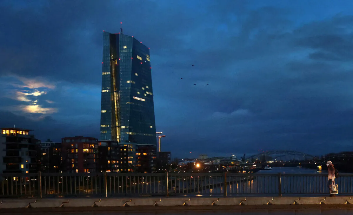 A woman walks past the European Central Bank (ECB) headquarters in Frankfurt, Germany, on Jan. 28, 2021. (Kai Pfaffenbach/Reuters)