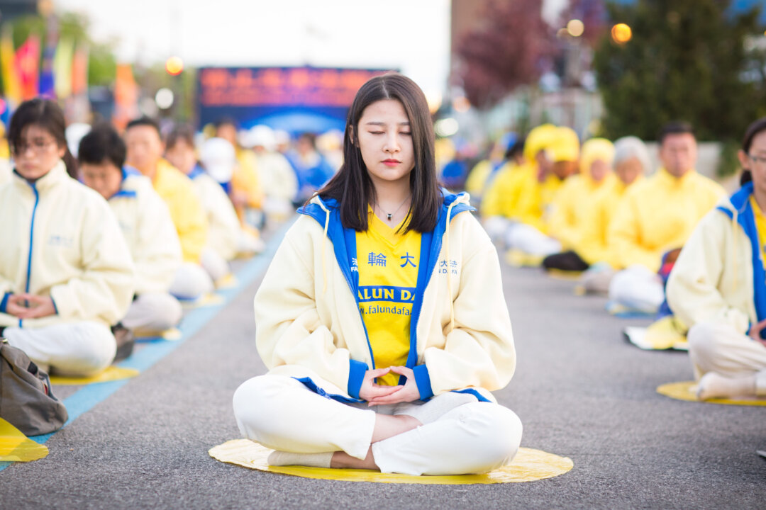 Hundreds of Falun Gong practitioners hold a vigil near the Chinese Consulate in New York for World Falun Dafa Day on May 11, 2017. (The Epoch Times)