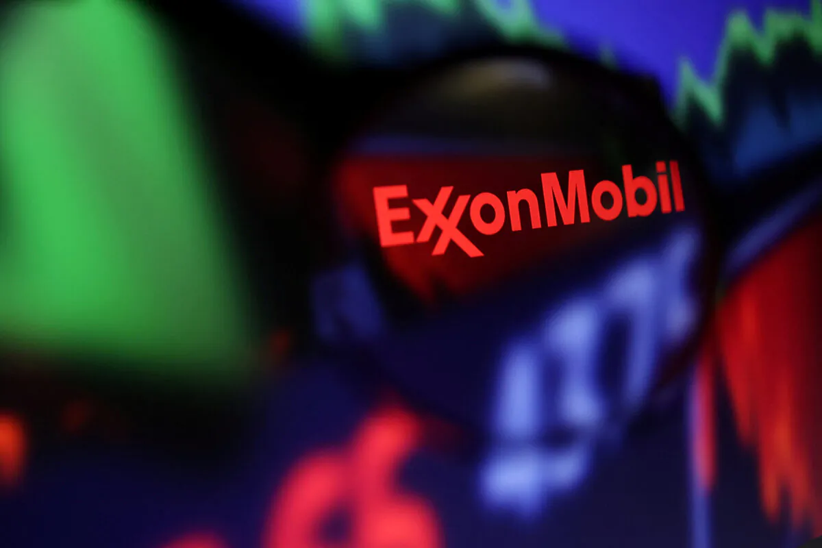 Exxon Mobil logo and stock graph are seen through a magnifier displayed in this illustration taken on Sept. 4, 2022. (Dado Ruvic/Reuters)