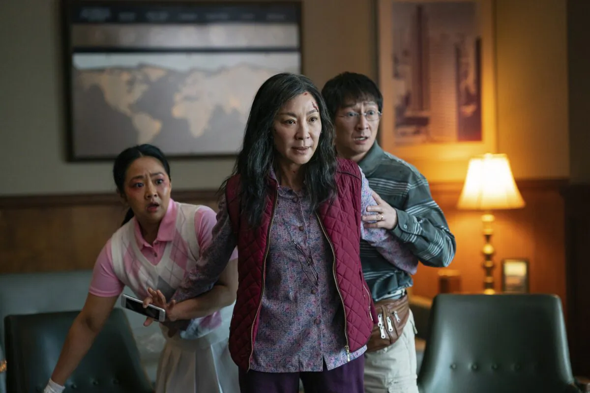 (L–R) Stephanie Hsu, Michelle Yeoh, and Ke Huy Quan in a scene from "Everything Everywhere All At Once." (Allyson Riggs/A24 Films via AP)