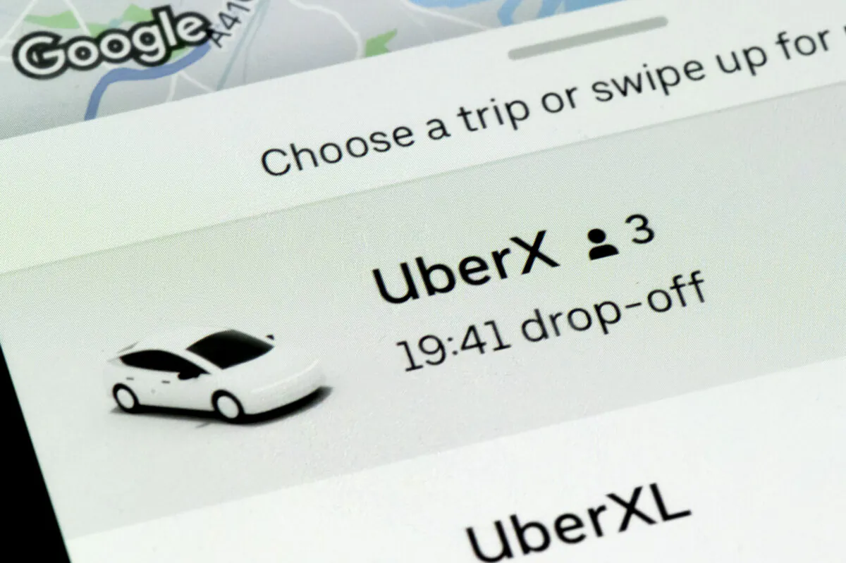 A close-up of an Uber app is seen on an iPhone in Cardiff, Wales, on Feb. 19, 2021. (Matthew Horwood/Getty Images)