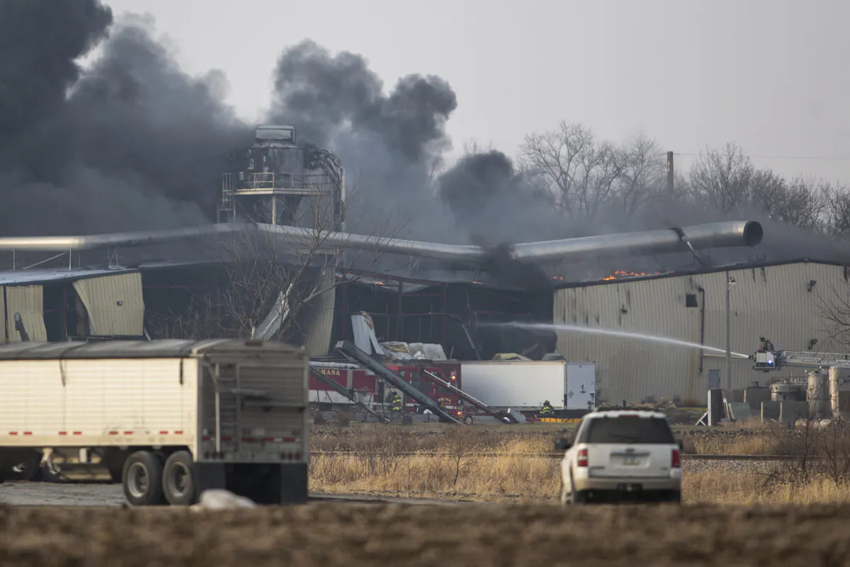 Firefighters work to control a blaze at a grain elevator in Marengo, Iowa, on Dec. 8, 2022. (Joseph Cress/Iowa City Press-Citizen via AP)