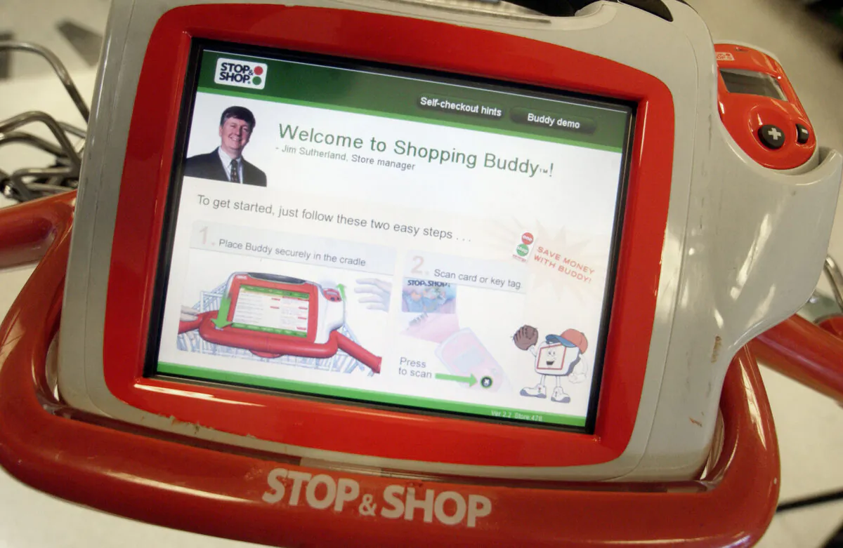 A touch screen 'Shopping Buddy' is seen at a Stop & Shop in Braintree, Mass., on July 21, 2004. The Shopping Buddy is a wireless touch screen device, attached to the shopping cart, that scans items, gives prices, shows items on sale, and even gives a customer their personal shopping history. (Photo by Darren McCollester/Getty Images)