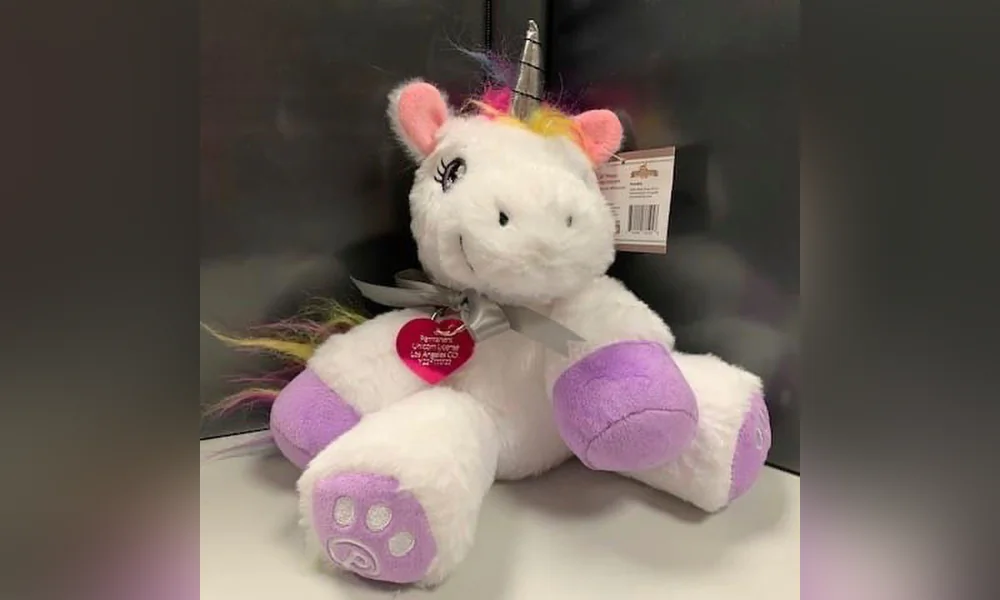 This image released by the Los Angeles County Animal Care and Control and posted via Instagram, shows a plush toy unicorn, wearing a heart-shape tag, after a young girl requested permission to have a unicorn in her backyard, if she could find one. (Los Angeles County Animal Care and Control via AP)