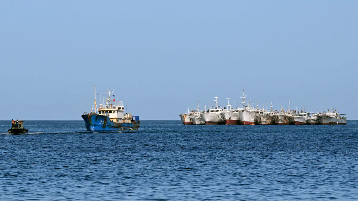 A Chinese-flagged fishing vessel (2nd L) entering Suva Harbour in Fiji on July 15, 2022. (William West/AFP via Getty Images)