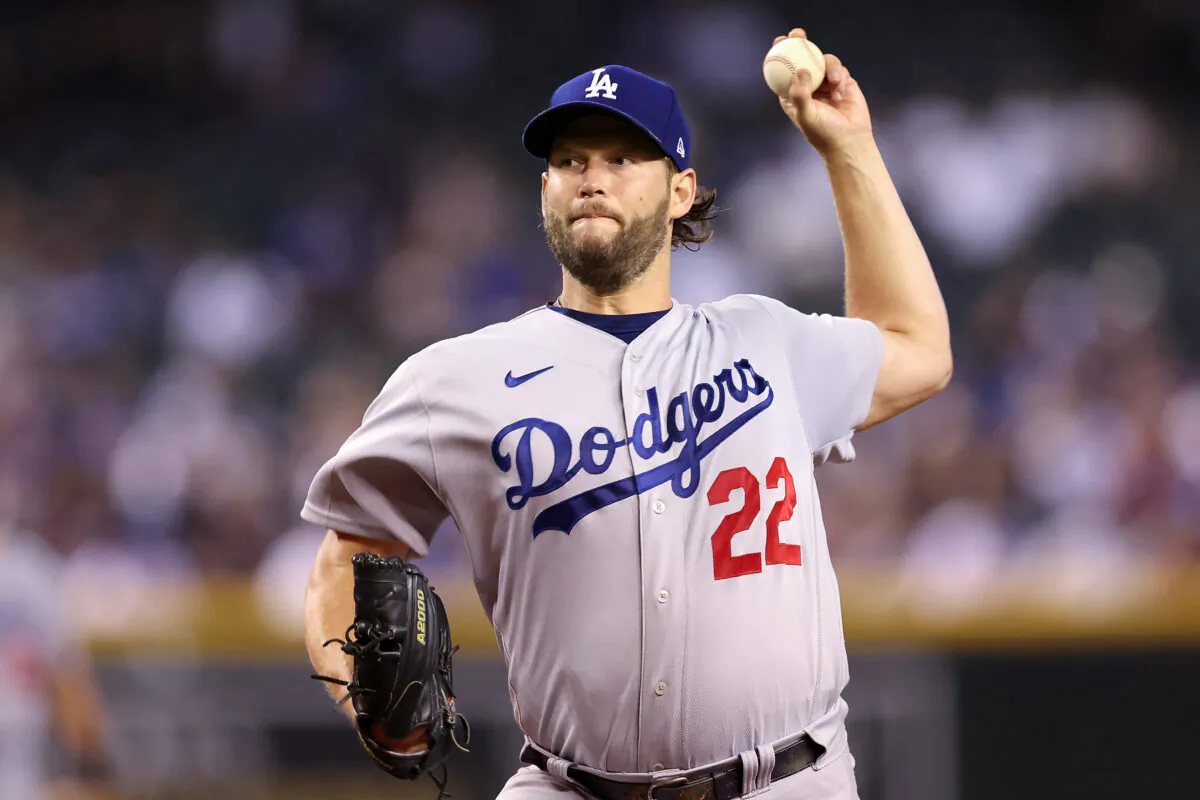 Starting pitcher Clayton Kershaw (22) of the Los Angeles Dodgers throws a warm-up pitch during the first inning of the MLB game against the Arizona Diamondbacks at Chase Field in Phoenix, on Sept. 13, 2022. (Christian Petersen/Getty Images)