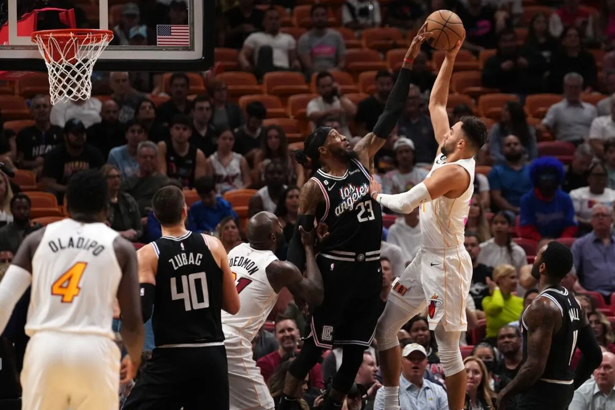 LA Clippers forward Robert Covington (23) blocks the shot of Miami Heat guard Max Strus (31) during the first half at FTX Arena in Miami, on Dec. 8, 2022. (Jasen Vinlove/USA TODAY Sports via Field Level Media)