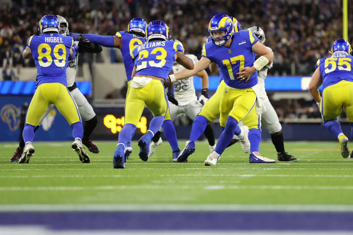Baker Mayfield (17) of the Los Angeles Rams hands the ball to Kyren Williams (23) during the third quarter against the Los Angeles Rams at SoFi Stadium in Inglewood, Calif.,  on Dec. 8, 2022. (Sean M. Haffey/Getty Images)