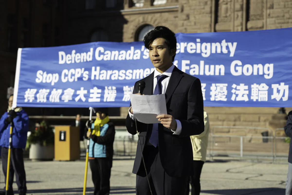 An adherent of the spiritual practice Falun Gong speaks during a rally on Dec. 8 at Queen's Park, Toronto, where demonstrators voice support for a bill that would ban force organ harvesting. A banner reads "Defend Canadian Sovereignty, Stop CCP's harassment of Falun Gong." (Evan Ning/The Epoch Times)