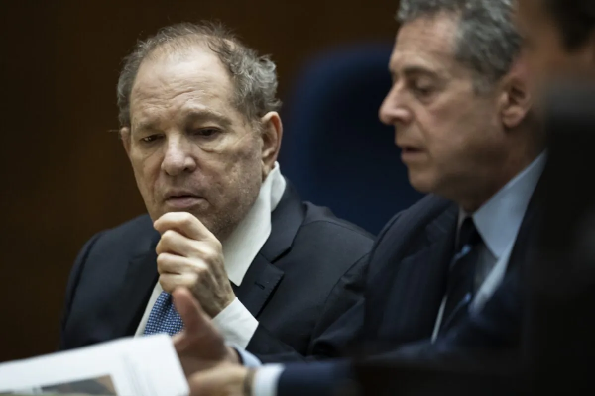 Former film producer Harvey Weinstein (L) interacts with his attorney Mark Werksman in court at the Clara Shortridge Foltz Criminal Justice Center, in  in Los Angeles, Calif., on Oct. 4, 2022. (Etienne Laurent-Pool/Getty Images)