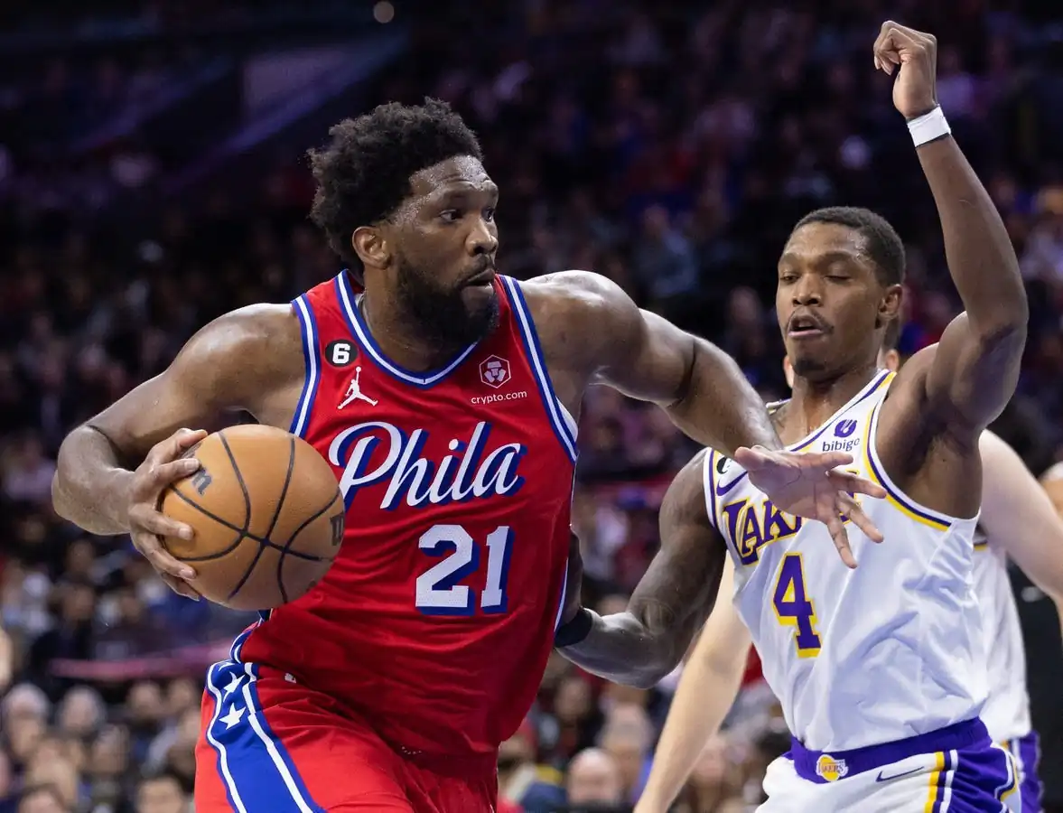Philadelphia 76ers center Joel Embiid (21) drives past Los Angeles Lakers guard Lonnie Walker IV (4) during the first quarter at Wells Fargo Center, in Philadelphia, on Dec. 9, 2022. (Bill Streicher/USA TODAY Sports via Field Level Media)