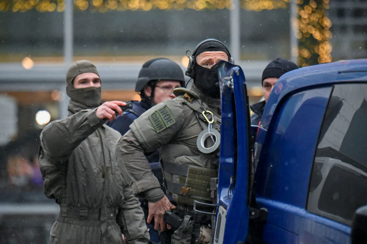 Security forces secure the area at a Christmas market in Dresden, Germany, on Dec. 10, 2022. (Matthias Rietschel/Reuters)