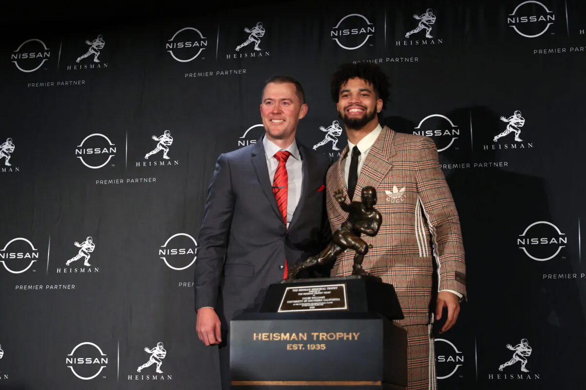 (L-R) Head coach Lincoln Riley and Quarterback Caleb Williams of the USC Trojans pose during a press conference after winning the 2022 Heisman Trophy at the New York Marriott Marquis Hotel in New York City, on Dec. 10, 2022. (Sarah Stier/Getty Images)