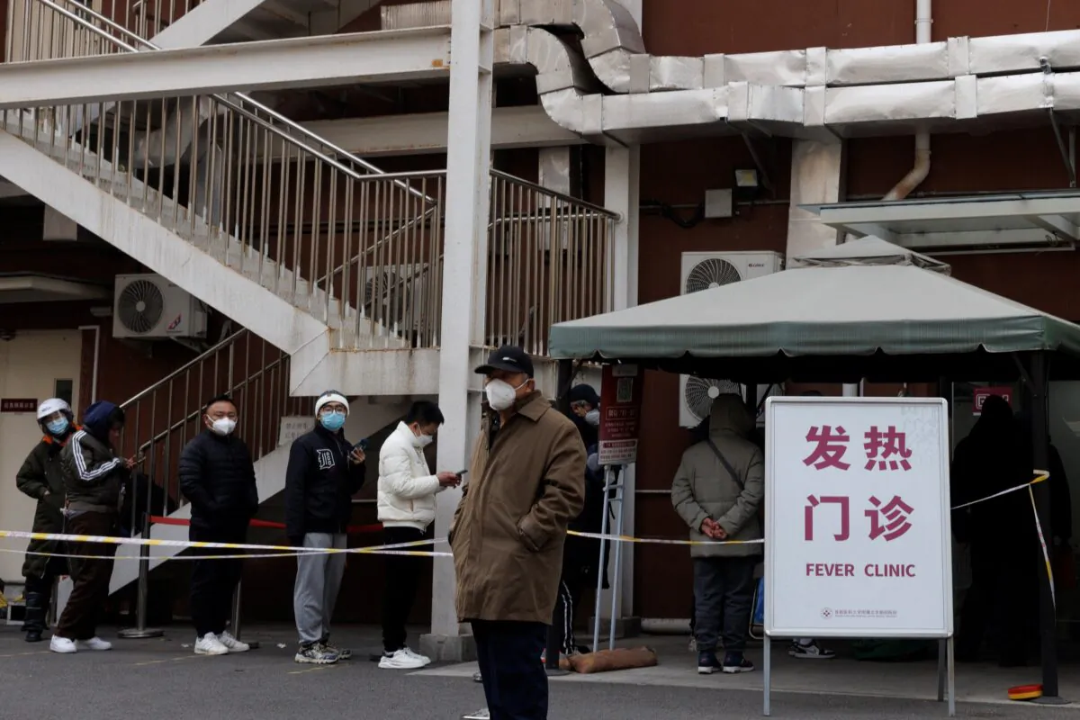 People line up at the fever clinic of a hospital as COVID-19 outbreaks continue in Beijing on Dec. 9, 2022. (Thomas Peter/Reuters)