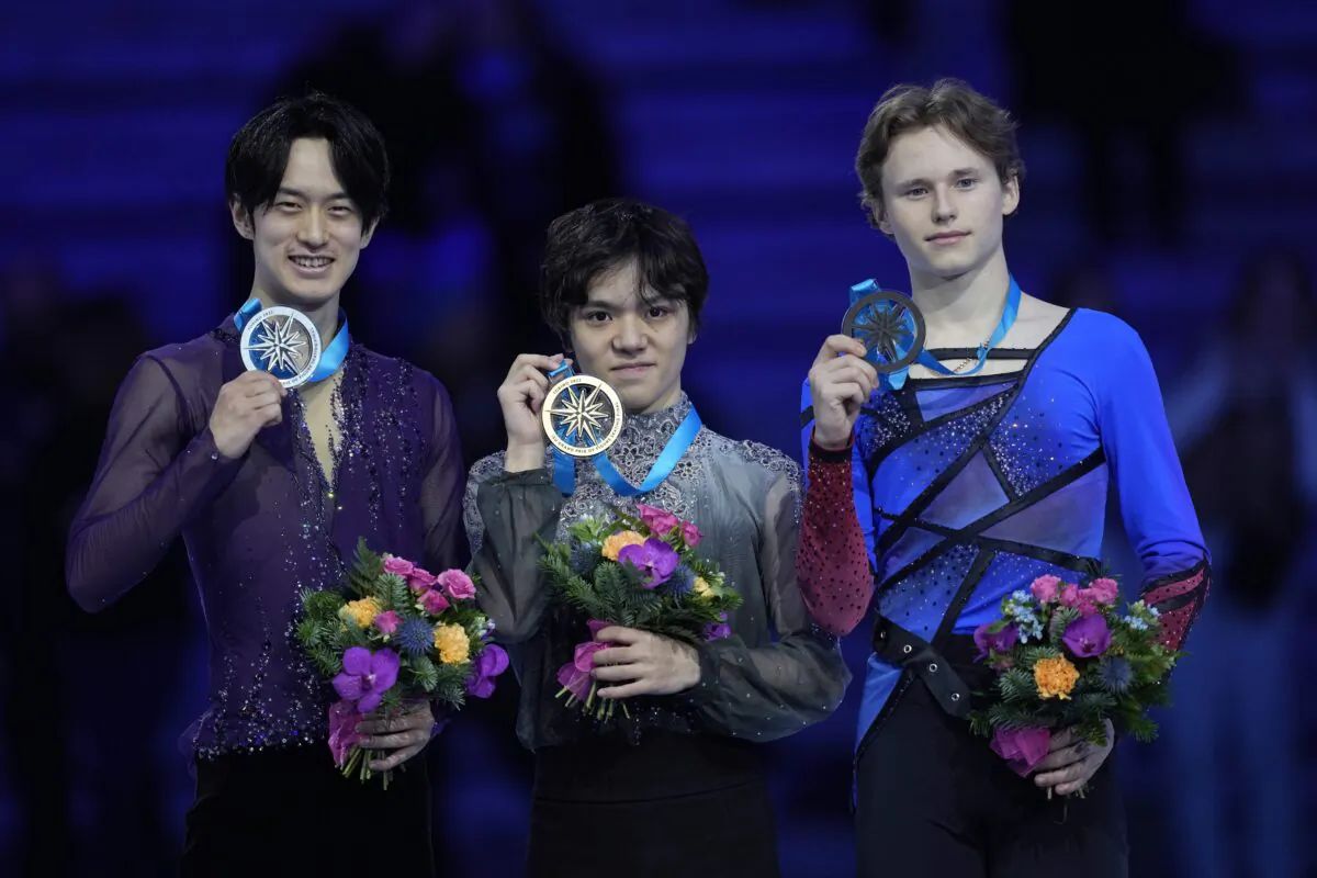 First place Japan's Shoma Uno (C), second place Japan's Sota Yamamoto (L), and third place United States' Ilia Malinin pose with their medals during the victory ceremony for the men's singles skating at the figure skating Grand Prix finals at the Palavela ice arena, in Turin, Italy, on Dec. 10, 2022. (Antonio Calanni/AP Photo)