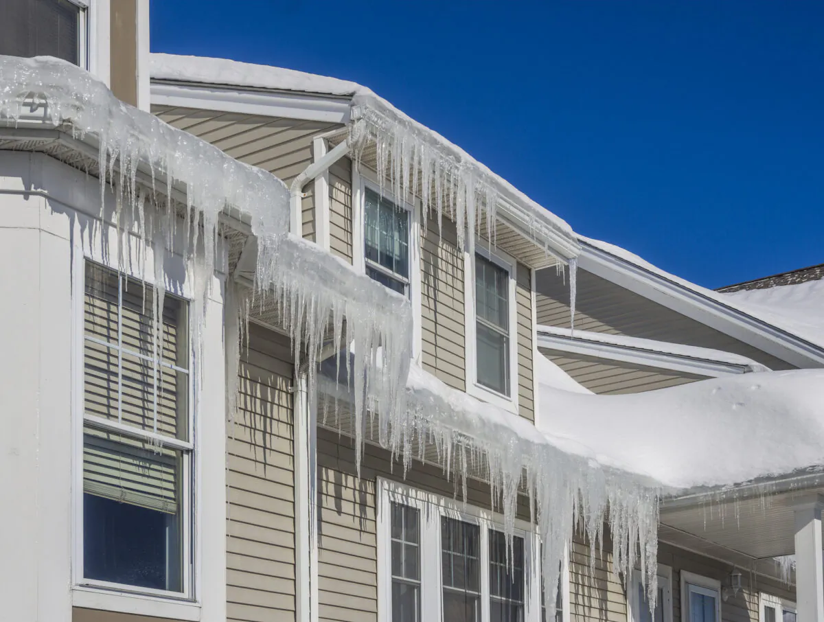 Heavy icicles are a sign of roof dams, which can be damaging to your roof and need to be addressed quickly. (Christian Delbert/Dreamstime/TNS)