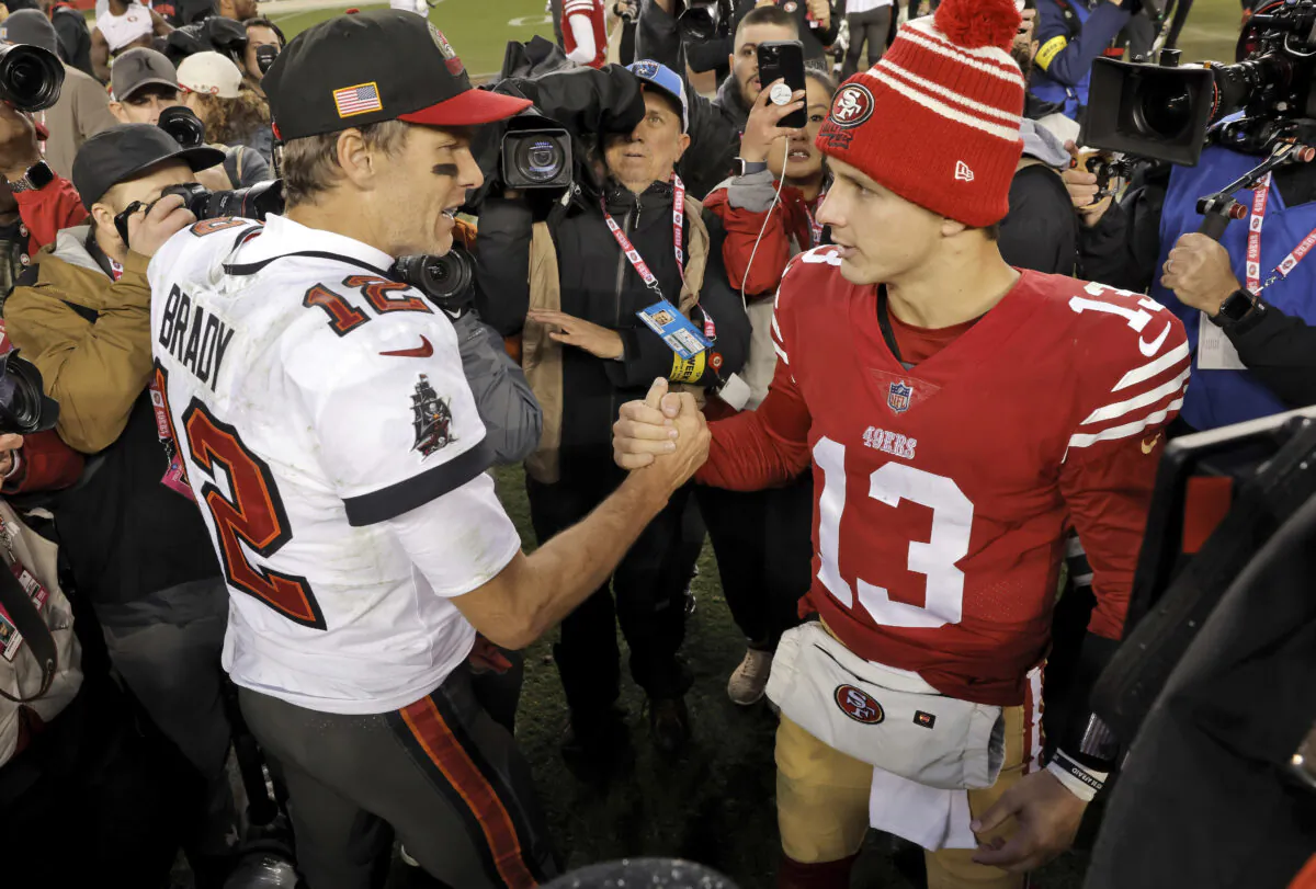 Tampa Bay Buccaneers quarterback Tom Brady (12) congratulates San Francisco 49ers quarterback Brock Purdy (13) after an NFL football game in Santa Clara, Calif., on Dec. 11, 2022. (Carlos Avila Gonzalez/San Francisco Chronicle via AP)