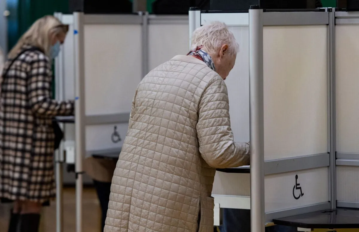 People fill out their ballots at Cathedral High School in Boston, Massachusetts, on Nov. 8, 2022. (Joseph Prezioso/AFP via Getty Images)