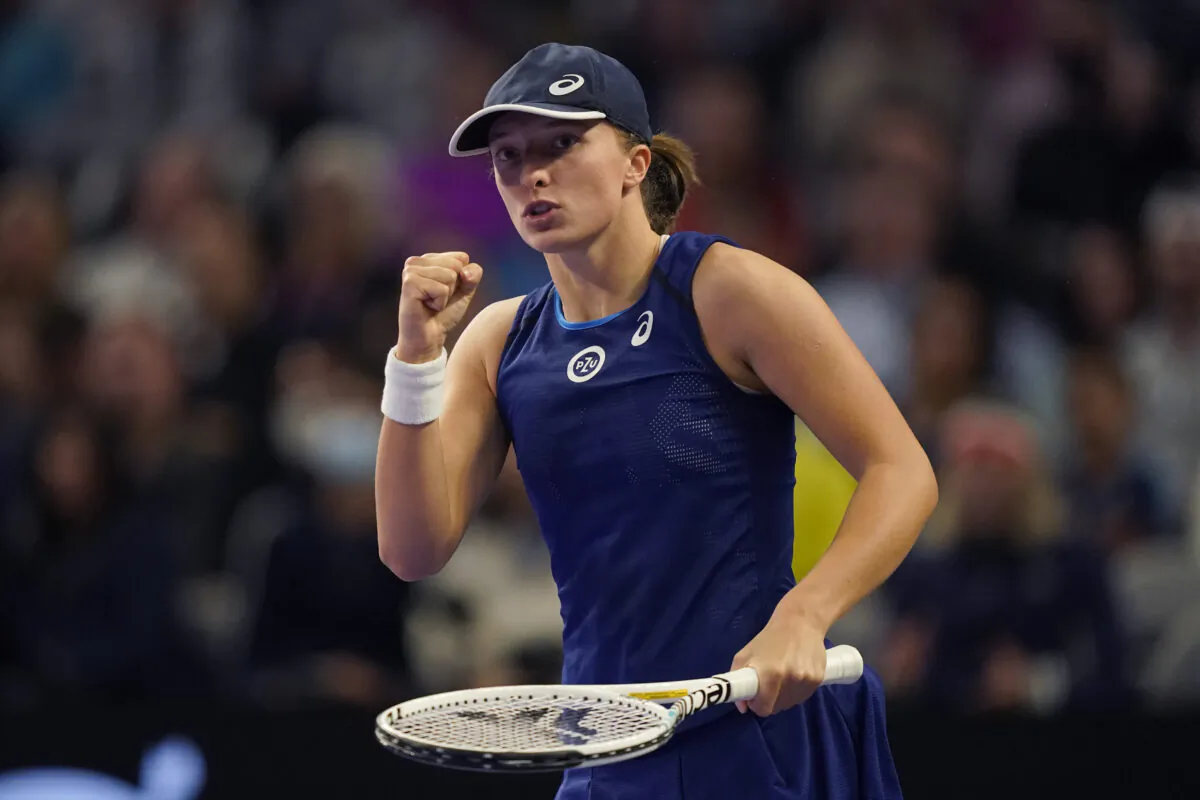 Iga Swiatek of Poland reacts to scoring a point during the first set against Coco Gauff of the United States during round-robin play on day six of the WTA Finals tennis tournament in Fort Worth, Texas, on Nov. 5, 2022. (LM Otero/AP Photo)