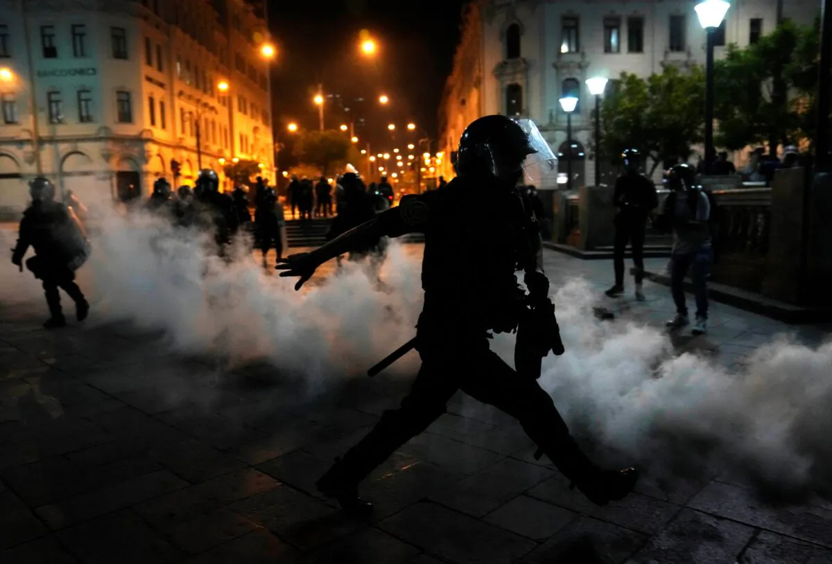 Tear gas is returned to police trying to break up supporters of ousted President Pedro Castillo at Plaza San Martin in Lima, Peru, on Dec. 11, 2022. (Martin Mejia/AP Photo)
