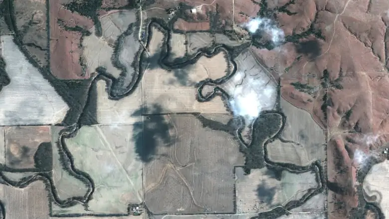 A satellite image from Saturday shows an overview of the crude oil spill along Mill Creek in Kansas following the leak at the Keystone pipeline operated by TC Energy. (Maxar Technologies via Reuters)
