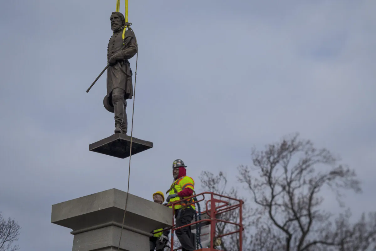 The bronze statue of Lieutenant General A.P. Hill is removed from its pedestal in Richmond, Va., on Dec. 12, 2022. (John C. Clark/AP Photo)