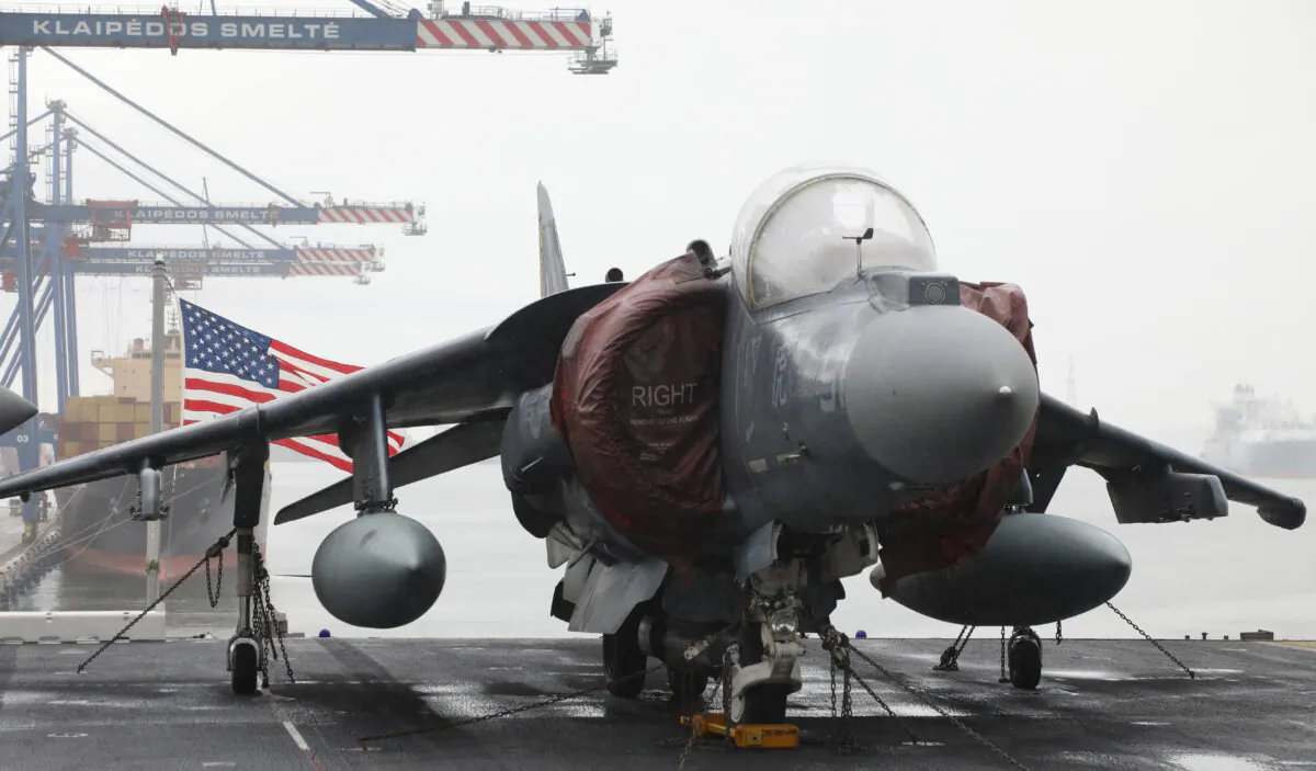 An AV-8B Harrier Jet aircraft sits on the deck of Wasp-class amphibious assault ship USS Kearsarge of the United States Navy, at the seaport of Klaipeda, Lithuania, on Aug. 22, 2022. (Petras Malukas/AFP via Getty Images)