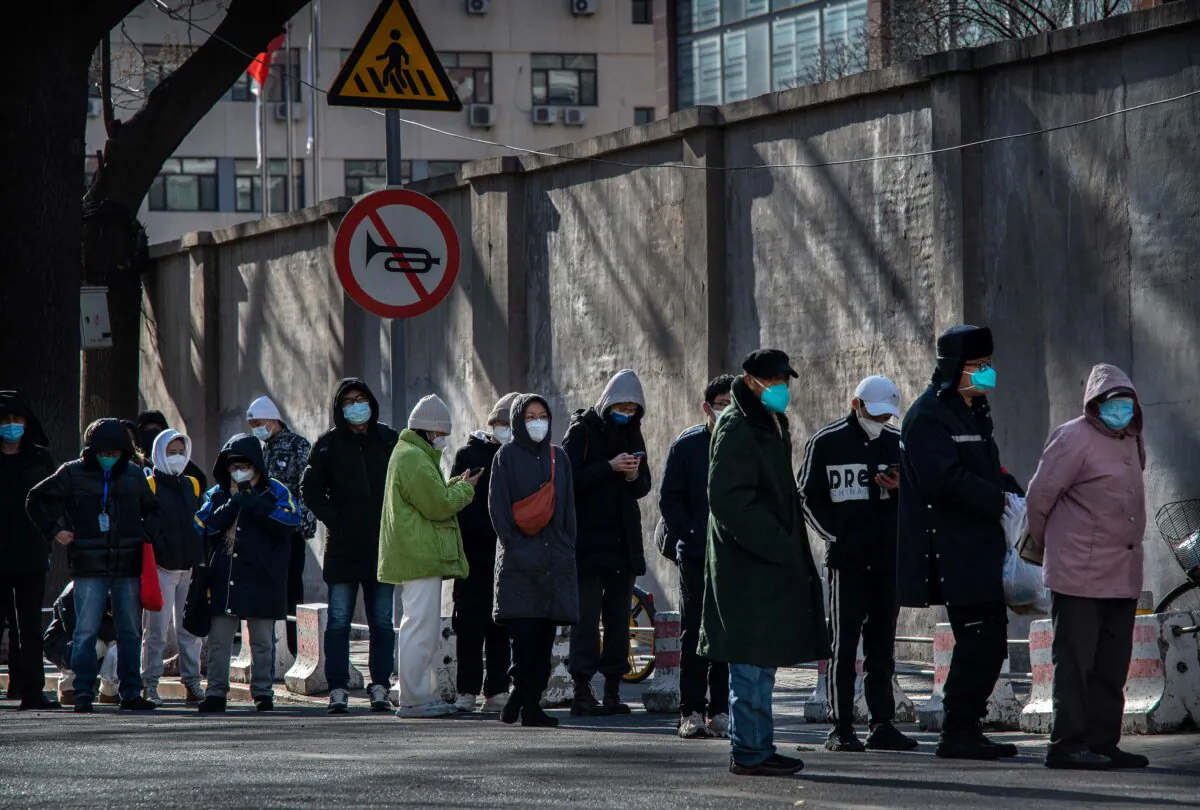 People line up outside a fever clinic at a hospital in the morning in in Beijing, China, on Dec. 11, 2022. (Kevin Frayer/Getty Images)