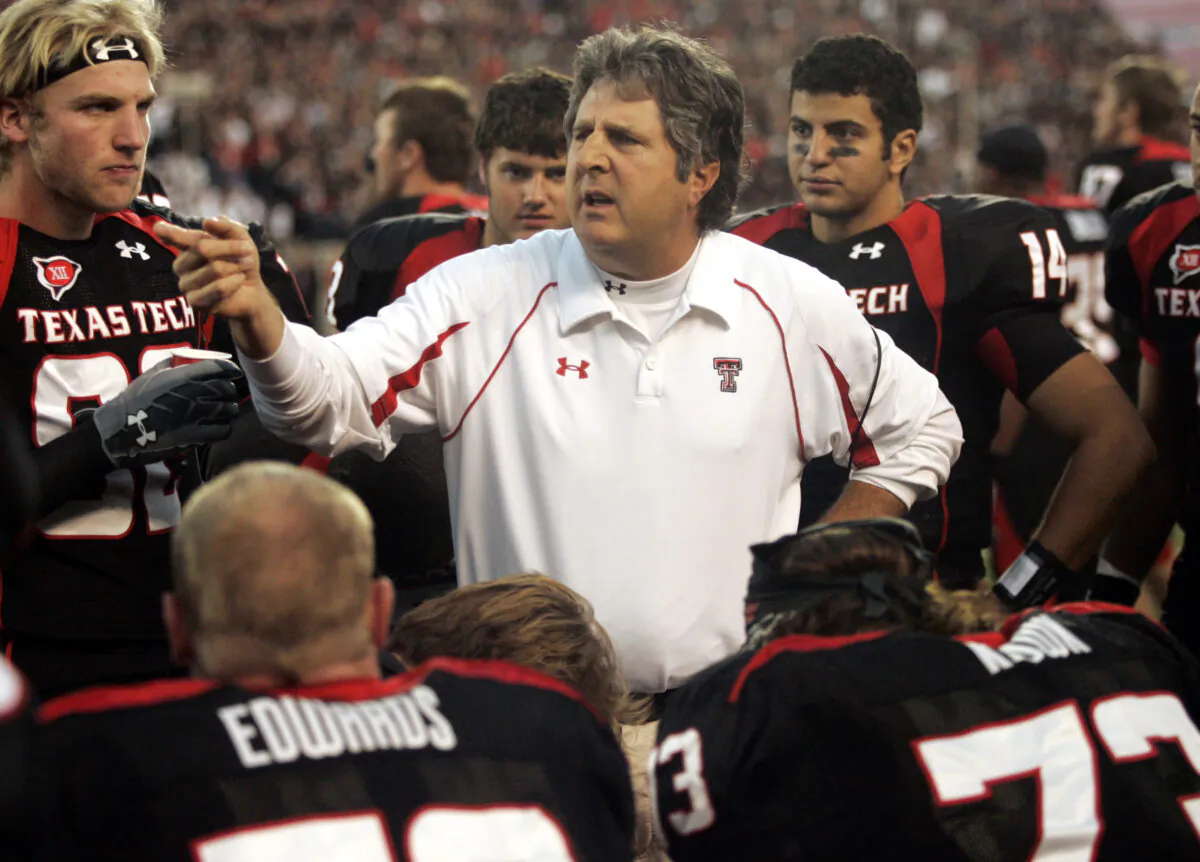 Texas Tech head coach Mike Leach talks with his team in the second quarter of an NCAA college football game against Texas A&M in Lubbock, Texas, on Oct. 24, 2009. (Mike Fuentes/AP Photo)