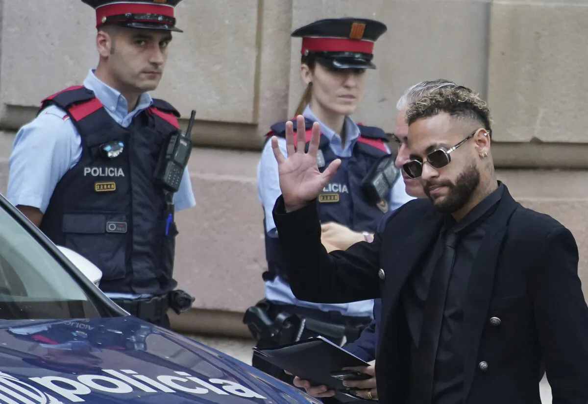 Former FC Barcelona player Neymar who now plays for Paris Saint-Germain waves on arrival at a court in Barcelona, Spain, on Oct. 17, 2022. (Joan Mateu Parra/AP Photo)