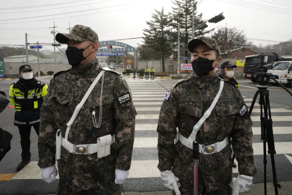 South Korean army soldiers stand guard before K-pop band BTS's member Jin enters the army to serve near an army training center in Yeoncheon, South Korea, on Dec. 13, 2022. (Ahn Young-joon/AP Photo)