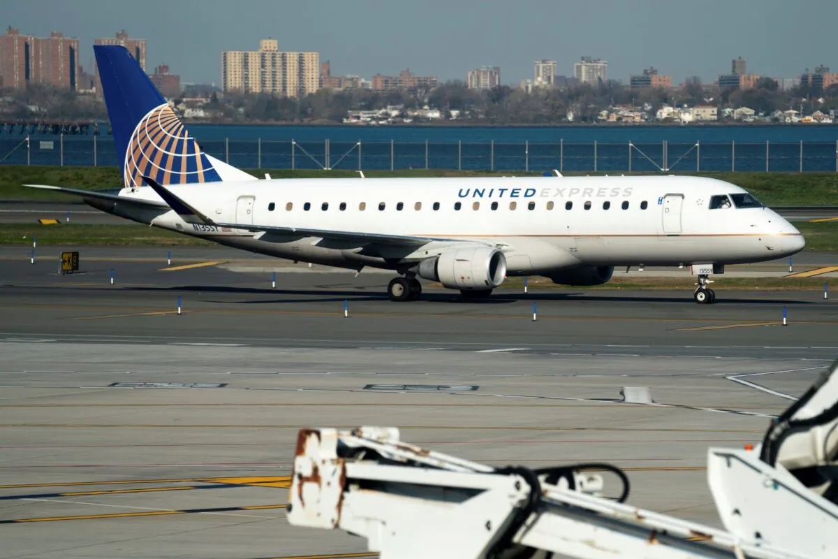 A United Airlines plane at LaGuardia Airport's Terminal B in New York on Nov. 22, 2022. (Julia Nikhinson/AP Photo)