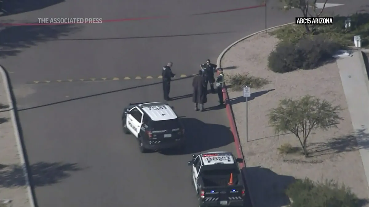 Law enforcement outside an Amazon delivery hub in the Phoenix suburb of Chandler, Ariz., on Dec. 14, 2022. (KNXV via AP)