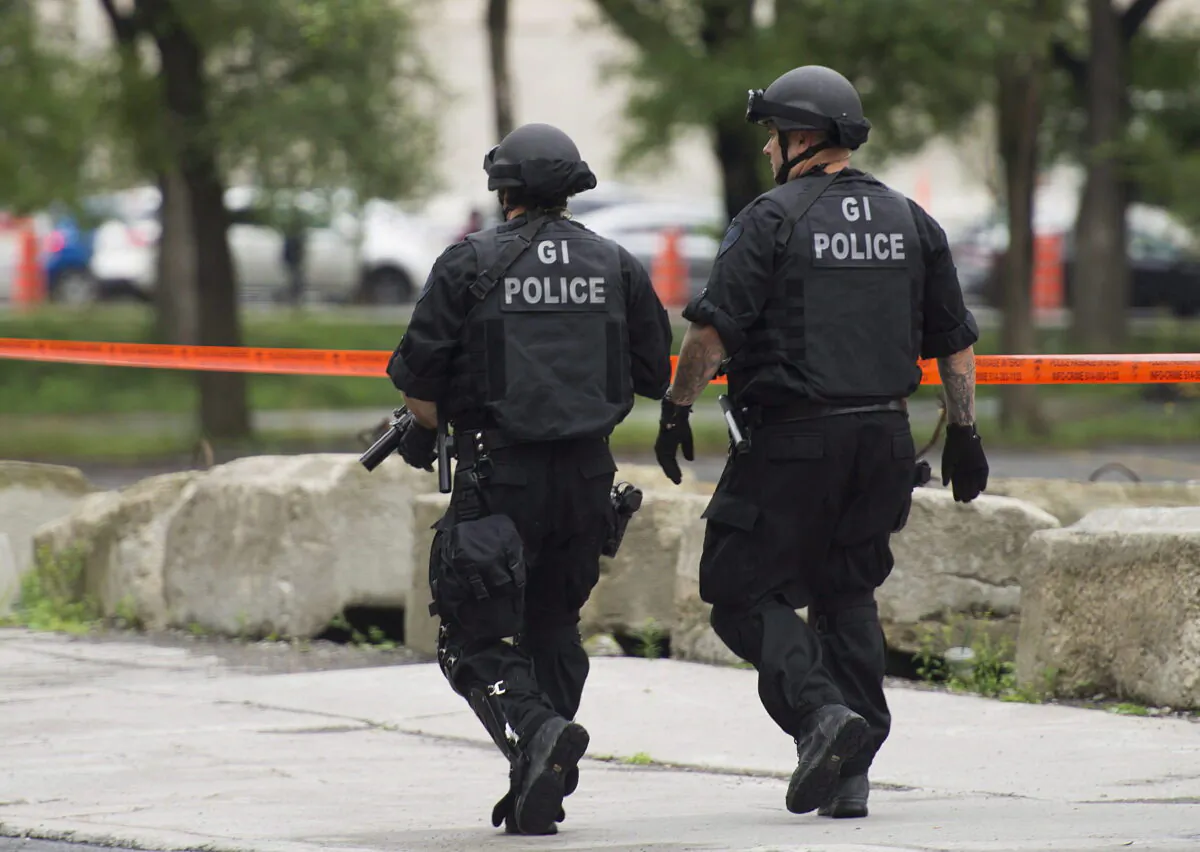 Armed police respond to an incident in Montreal in a file photo. (The Canadian Press/Graham Hughes)