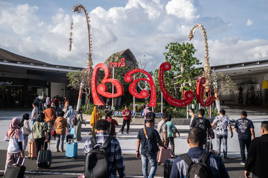 Local tourists flock at the domestic arrival of Ngurah Rai airport in Denpasar, Bali, Indonesia, on Dec. 7, 2022. (Agung Parameswara/Getty Images)