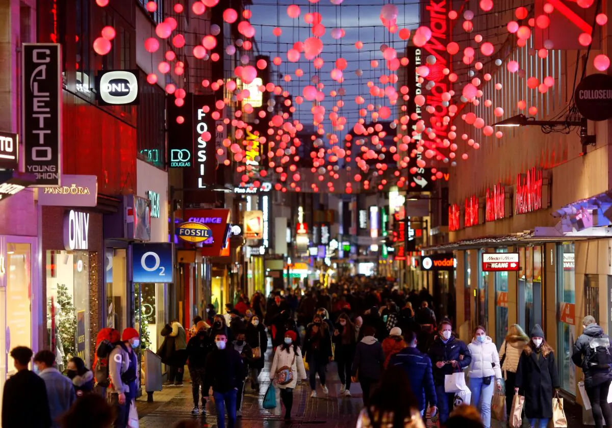 Shoppers walk down the main shopping street Hohe Strasse in Cologne, Germany, on Dec. 15, 2020. (Thilo Schmuelgen/Reuters)