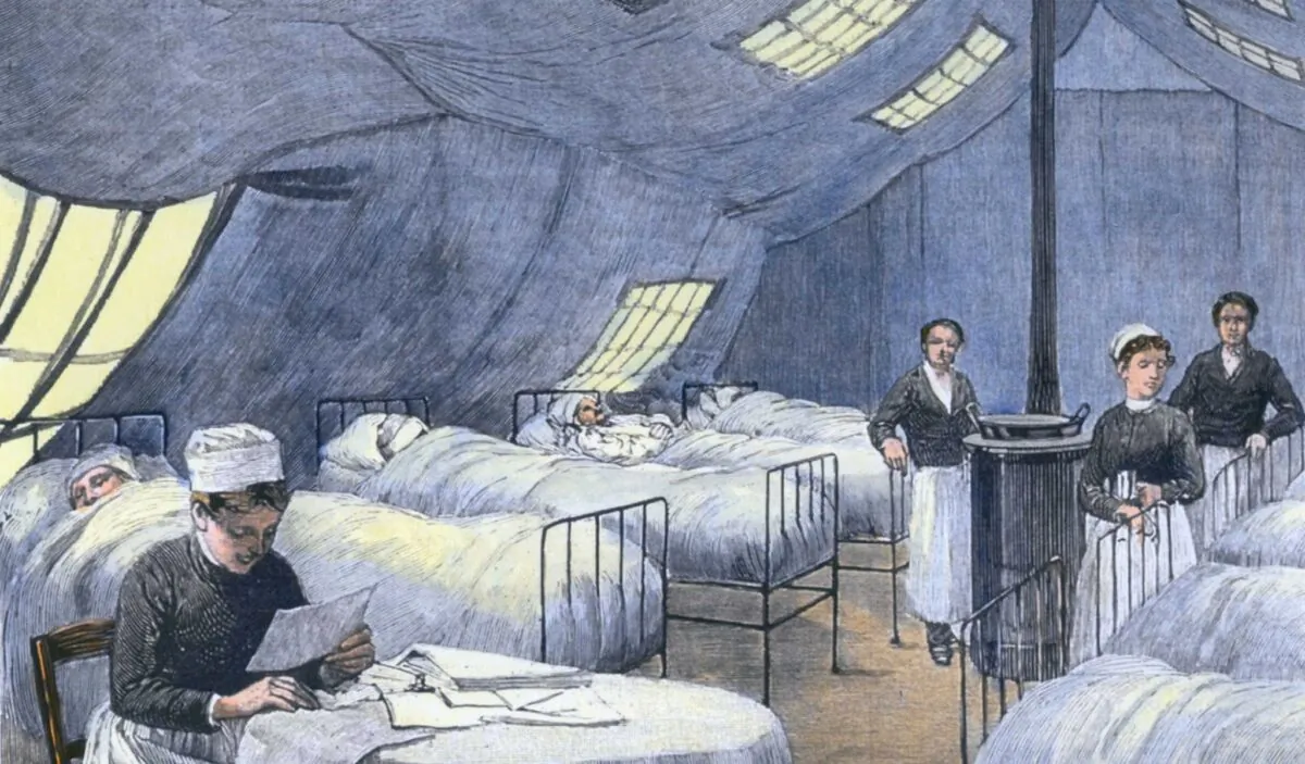 Asian Flu epidemic of 1889–90 in Paris patients are treated in a supplemental tent hospital. A nurse attends to several patients during the winter of 1889–90. (Everett Collection/Shutterstock)