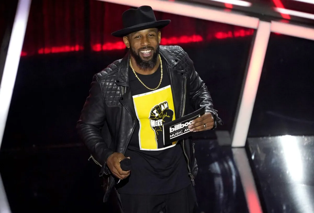 Stephen "tWitch" Boss presents the award for top Latin artist at the Billboard Music Awards in Los Angeles on Oct. 14, 2020. (Chris Pizzello/AP Photo)
