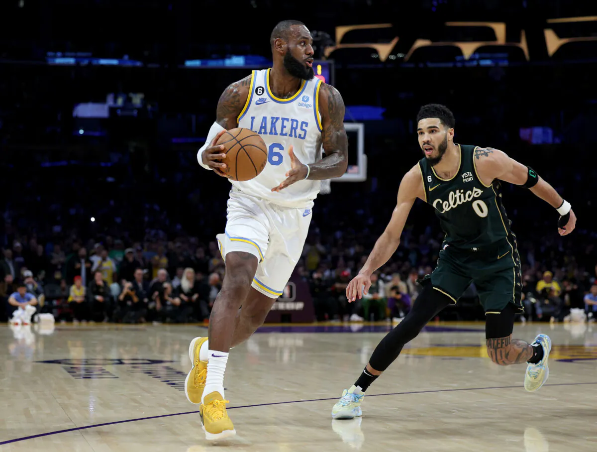 LeBron James (6) of the Los Angeles Lakers dribbles away from Jayson Tatum (0) of the Boston Celtics at Crypto.com Arena in Los Angeles, on Dec. 13, 2022. (Harry How/Getty Images)