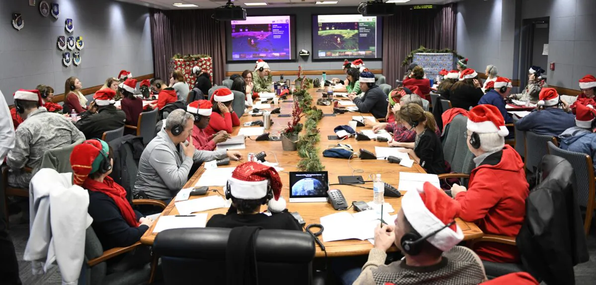 More
than 1,500 American
and Canadian
uniformed personnel,
Department of
Defense civilians,
and members of the
community volunteer
to help track
Santa and answer
thousands of phone
calls every year. (Courtesy of NORAD)