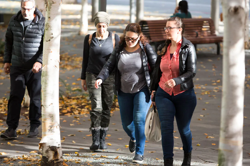 Zeina Abouammo, second right, whose husband, US citizen Ahmad Abouammo, is accused of using his position at Twitter to spy on accounts, arrives for a detention hearing at US District Court, Western District of Washington in Seattle, Wash., on Nov. 8, 2019. (Photo by Jason Redmond / AFP via Getty Images)