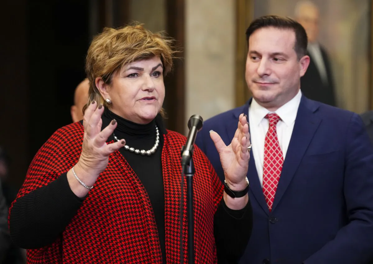 Minister of Public Safety Marco Mendicino and Minister of Rural Economic Development Gudie Hutchings speak to reporters in the foyer of the House of Commons on Parliament Hill in Ottawa on Dec. 14, 2022, regarding Bill C-21. (Sean Kilpatrick/The Canadian Press)